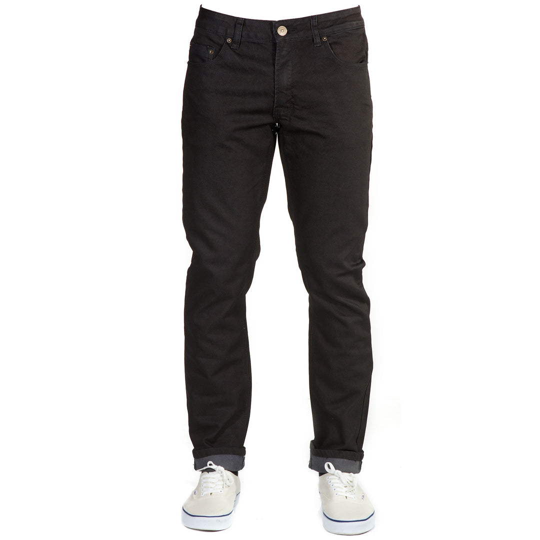 Sleek Front View: Blackout Denim - Slim Fit - 6th Gen Bulletprufe Jeans. Crafted from a mix of organic cotton, ballistic nylon, recycled polyester (sourced from water bottles), and elastane.