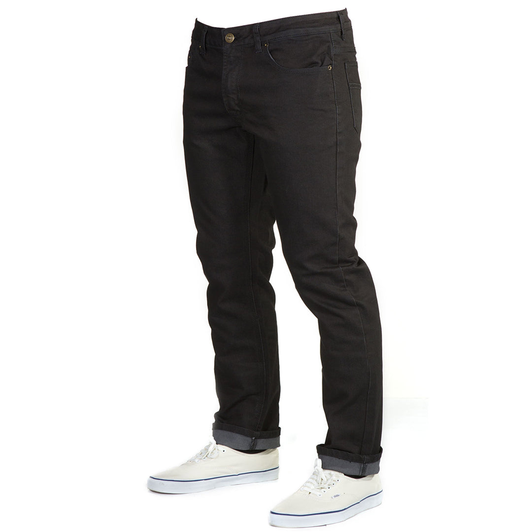 Angled view: Blackout Denim - Adventure Fit - 6th Gen Bulletprufe Jeans. The cotton blend ensures breathability and softness, while the ballistic nylon and PET components enhance strength and resilience.