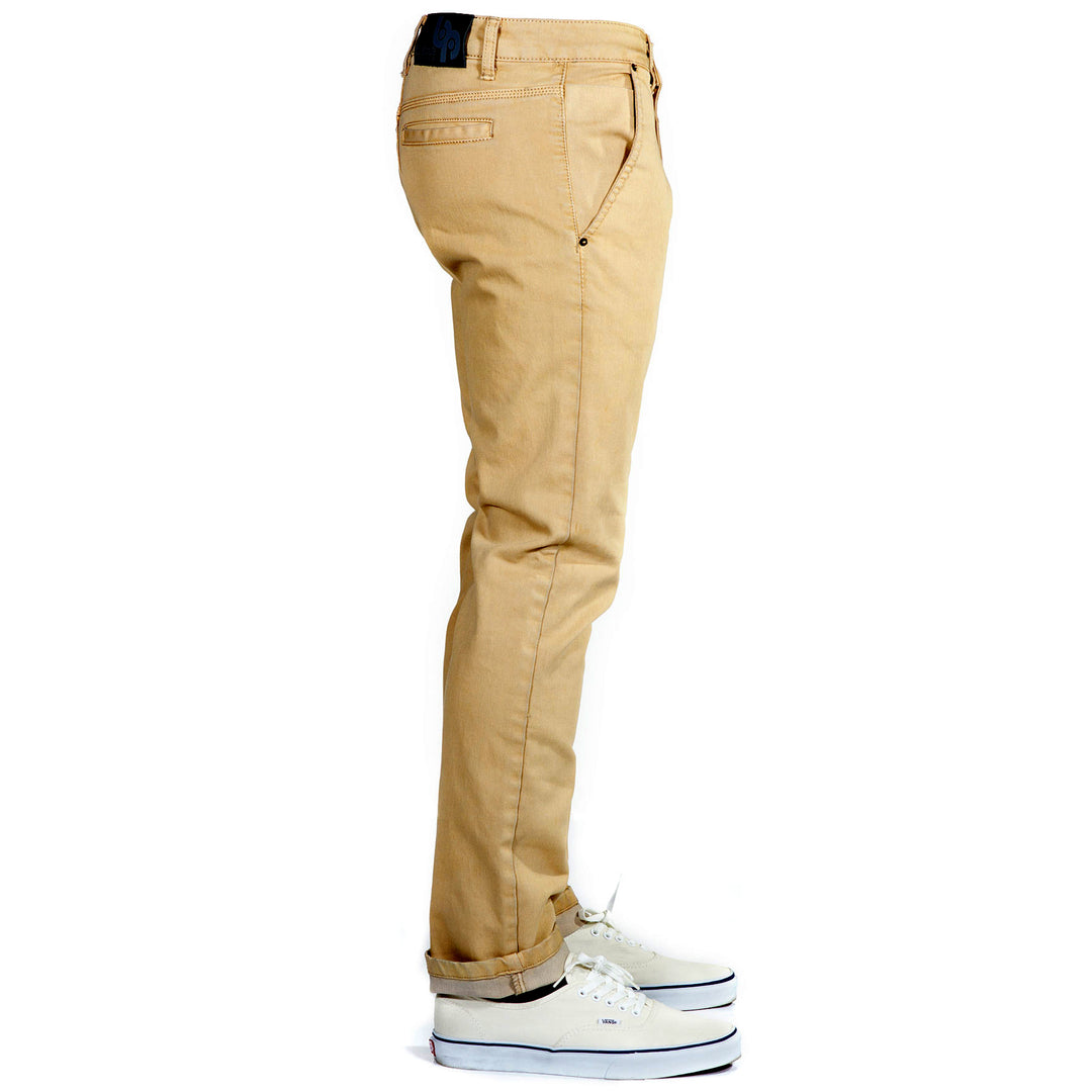 Side view of Bulletprufe Jeans Serengeti Tan Tsavo Khakis - Slim Fit. Designed with the same quad-blend fabric as our jeans, these khakis offer wrinkle-free, super stretchy comfort, perfect for versatile wear from weekdays to weekends.