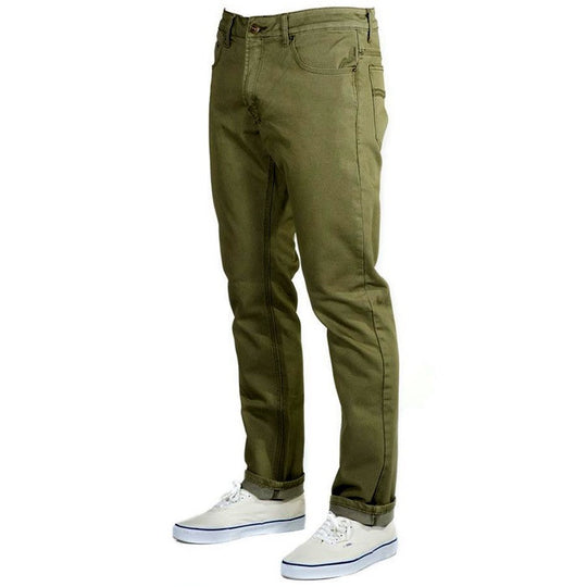 Perspective view of Olive Green Kush Denim - Slim Fit - 6th Gen pants, emphasizing their versatile style. Exceptional durability, softness, and comfort, thanks to our proprietary organic cotton, super rugged ballistic nylon, PET (sourced from recycled water bottles), and elastane blend.