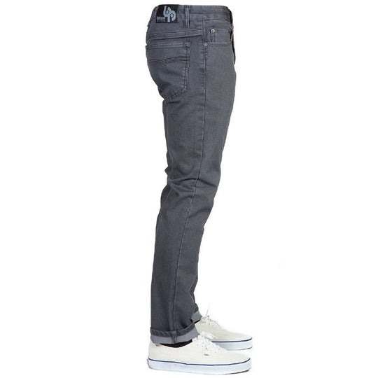 Side view of Slate Grey Denim - Slim Fit - 4th Gen Bulletprufe Jeans, organic cotton, super rugged ballistic nylon, PET (recycled/upcycled water bottles), and Freedom of Movement elastane, highlighting their sleek and versatile design.