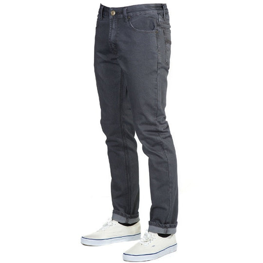 Perspective view of Slate Grey Denim - Slim Fit - 4th Gen Bulletprufe Jeans, organic cotton, super rugged ballistic nylon, PET (recycled/upcycled water bottles), and Freedom of Movement elastane, showcasing their stylish and versatile design.